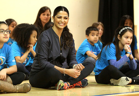 Camila sits with students at the Kid Power event.jpg