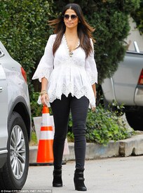 Boho babe! Camila looked stylish and showed off her long, slim pins in black skinny jeans and suede ankle boots.jpg