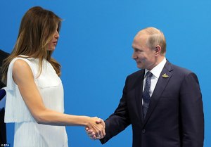 421FAB1D00000578-4675832-Earlier_on_Friday_Melania_Trump_left_greeted_Russian_President_V-a-84_1499460222220.jpg