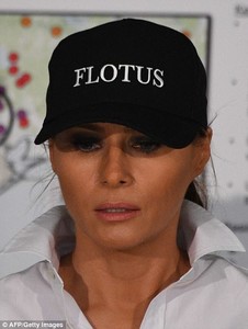 43AF255B00000578-4833236-Say_her_name_The_First_Lady_also_wore_a_black_cap_with_FLOTUS_wr-a-7_1504063784723.jpg
