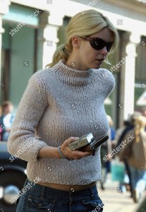 claudia-schiffer-and-assistant-shopping-for-baby-clothes-london-britain-shutterstock-editorial-415482r.jpg