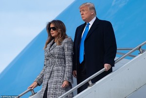 5589378-6332041-Here_to_mourn_Donald_and_Melania_Trump_walked_down_from_Air_Forc-a-46_1540931925184.jpg