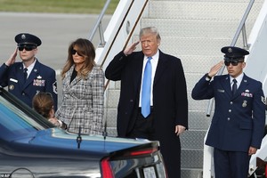 5589454-6332041-Touch_down_Trump_salutes_as_he_departs_Air_Force_One_on_his_way_-a-48_1540931925185.jpg