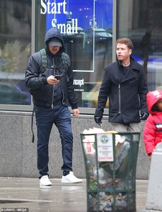 25195414-8044379-Multitasking_Leo_checked_out_his_phone_as_he_walked_with_Connoll-a-2_1582675879674 (1).jpg