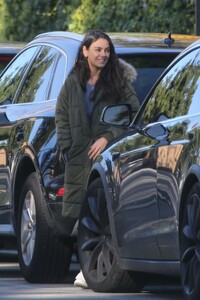 mila-kunis-wears-green-puffer-jacket-beverly-hills-01-17-2023-3.jpg