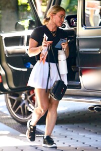 hilary-duff-in-a-white-miniskirt-arrives-at-sunset-towers-in-west-hollywood-07-11-2023-6.jpg
