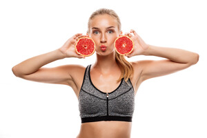 beautiful-sportive-woman-posing-holding-grapefruit.jpg